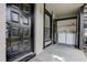 Front porch with black front door and closet with laundry machines at 4012 Tumble Wood Trl # 104, Tampa, FL 33613
