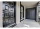 Front porch with black front door and closet for the laundry machines at 4012 Tumble Wood Trl # 104, Tampa, FL 33613