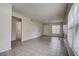 Spacious living room featuring tile flooring and bright windows for natural light at 4012 Tumble Wood Trl # 104, Tampa, FL 33613