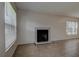 Bright living room featuring a cozy fireplace and tile flooring at 4012 Tumble Wood Trl # 104, Tampa, FL 33613