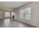 Comfortable living room featuring tile floors, fireplace, and large bright windows at 4012 Tumble Wood Trl # 104, Tampa, FL 33613