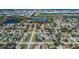 Aerial view of a residential neighborhood with lakes, showcasing the property's location within the community at 4085 105Th N Ave, Clearwater, FL 33762