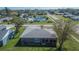 Aerial image displaying the home's backyard, greenery, and surrounding community pool amenities at 4085 105Th N Ave, Clearwater, FL 33762