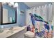 Charming bathroom with blue walls and a fun turtle-themed shower curtain at 4085 105Th N Ave, Clearwater, FL 33762