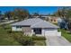 Charming single-story home with a well-maintained front yard and attached one-car garage in a quiet neighborhood at 4085 105Th N Ave, Clearwater, FL 33762