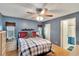 Cozy main bedroom with hardwood floors and a ceiling fan at 4085 105Th N Ave, Clearwater, FL 33762