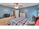 Comfortable main bedroom features neutral walls, a ceiling fan, and hardwood floors at 4085 105Th N Ave, Clearwater, FL 33762