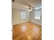 Spacious bedroom with a ceiling fan, neutral paint, and wood-look flooring at 4111 W Grace St, Tampa, FL 33607