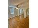 This bedroom has natural light, ceiling fan, and mirrored closet doors at 4111 W Grace St, Tampa, FL 33607