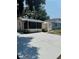 Exterior view of home with a screened porch and large driveway at 4111 W Grace St, Tampa, FL 33607