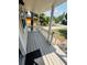Welcoming covered front porch with classic white picket fence and sunny neighborhood views at 4111 W Grace St, Tampa, FL 33607