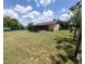 Expansive backyard featuring a screened lanai, perfect for outdoor enjoyment and relaxation at 432 Flamingo Dr, Apollo Beach, FL 33572