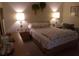 Comfortable bedroom featuring a large bed with lamps, and wood furniture at 432 Flamingo Dr, Apollo Beach, FL 33572