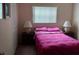 Cozy bedroom featuring a double bed, bedside tables with lamps and built-in closet at 432 Flamingo Dr, Apollo Beach, FL 33572