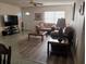 Cozy living room with comfortable sofas, complemented by natural light streaming through the window at 432 Flamingo Dr, Apollo Beach, FL 33572