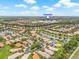 Beautiful aerial view of a community with water features and lush landscaping on a bright sunny day at 4911 Rock Island Ct, Wimauma, FL 33598