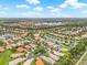 Sprawling community featuring numerous homes nestled among lakes and verdant landscaping from above at 4911 Rock Island Ct, Wimauma, FL 33598