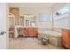 The primary bathroom features double sinks, a glass shower, and a soaking tub at 4911 Rock Island Ct, Wimauma, FL 33598