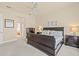 Relaxing bedroom showcasing a ceiling fan, soft lighting, and a dark wood bedroom set at 4911 Rock Island Ct, Wimauma, FL 33598