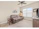 Comfortable bonus room with tiled floors, a ceiling fan, and a neutral color scheme at 4911 Rock Island Ct, Wimauma, FL 33598