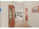 Hallway with tile floors, built in cabinet, and a view to the living room at 4911 Rock Island Ct, Wimauma, FL 33598