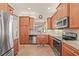 Well-lit kitchen featuring stainless steel appliances and granite countertops at 4911 Rock Island Ct, Wimauma, FL 33598