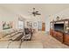 Spacious living room featuring tile floors, ceiling fan, and comfortable seating area at 4911 Rock Island Ct, Wimauma, FL 33598