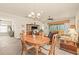 Open concept dining and living area with tile flooring at 4911 Rock Island Ct, Wimauma, FL 33598