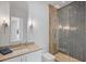 Modern bathroom featuring a glass shower with patterned tile and sleek vanity at 501 Barcelona Dr, Tierra Verde, FL 33715
