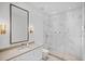 Luxurious bathroom with marble walk-in shower, contemporary vanity, and modern lighting at 501 Barcelona Dr, Tierra Verde, FL 33715