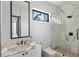 Bright bathroom with marble countertop, glass shower, and modern fixtures at 501 Barcelona Dr, Tierra Verde, FL 33715