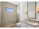 Modern bathroom featuring a glass shower, contemporary fixtures, and unique tile at 501 Barcelona Dr, Tierra Verde, FL 33715