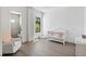 Bright Bedroom with luxury chair, window views, and a decorative baby's crib at 501 Barcelona Dr, Tierra Verde, FL 33715