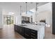 Spacious kitchen with skylights and modern island, seamlessly connecting to the living area at 501 Barcelona Dr, Tierra Verde, FL 33715