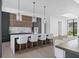 Gourmet kitchen featuring a marble island and seating and modern cabinetry and lighting at 501 Barcelona Dr, Tierra Verde, FL 33715