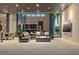 Open living room features a sectional sofa, gas fireplace, and retractable glass doors to the outdoors at 501 Barcelona Dr, Tierra Verde, FL 33715