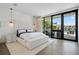 Bright and airy main bedroom with water views, hardwood floors, and a luxurious king bed at 501 Barcelona Dr, Tierra Verde, FL 33715