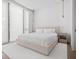 Bright main bedroom with natural light from large windows and sleek modern furnishings at 501 Barcelona Dr, Tierra Verde, FL 33715