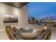 Upscale outdoor living space featuring a fire pit, water views, and comfortable seating at 501 Barcelona Dr, Tierra Verde, FL 33715