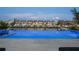Backyard infinity pool with views of waterfront properties, providing a luxurious outdoor experience at 501 Barcelona Dr, Tierra Verde, FL 33715