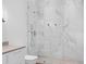 Luxurious bathroom featuring a spacious marble walk-in shower with glass surround at 501 Barcelona Dr, Tierra Verde, FL 33715