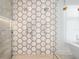Detailed view of a modern shower with geometric tile and dual showerheads at 501 Barcelona Dr, Tierra Verde, FL 33715