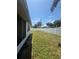Lawn area with a privacy fence, providing a secure and enjoyable outdoor space at 5025 Tammy Ln, Holiday, FL 34690
