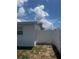 View of home's backyard showing a fenced in yard at 5025 Tammy Ln, Holiday, FL 34690