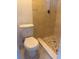 Tiled bathroom with a stand up shower, tiled shower floor and toilet at 5025 Tammy Ln, Holiday, FL 34690