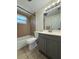 Cozy bathroom featuring a tiled shower-tub combo, neutral finishes, and modern vanity at 5025 Tammy Ln, Holiday, FL 34690