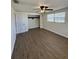 Inviting bedroom features vinyl flooring, a ceiling fan, and a closet at 5025 Tammy Ln, Holiday, FL 34690