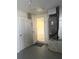 Hallway view with an HVAC system, storage closet and access to another room at 5025 Tammy Ln, Holiday, FL 34690