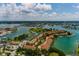 Aerial shot of waterfront property, tennis courts, and beautiful community at 505 Sandy Hook Rd # 505, Treasure Island, FL 33706