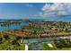 Panoramic view of waterfront property featuring tennis courts at 505 Sandy Hook Rd # 505, Treasure Island, FL 33706
